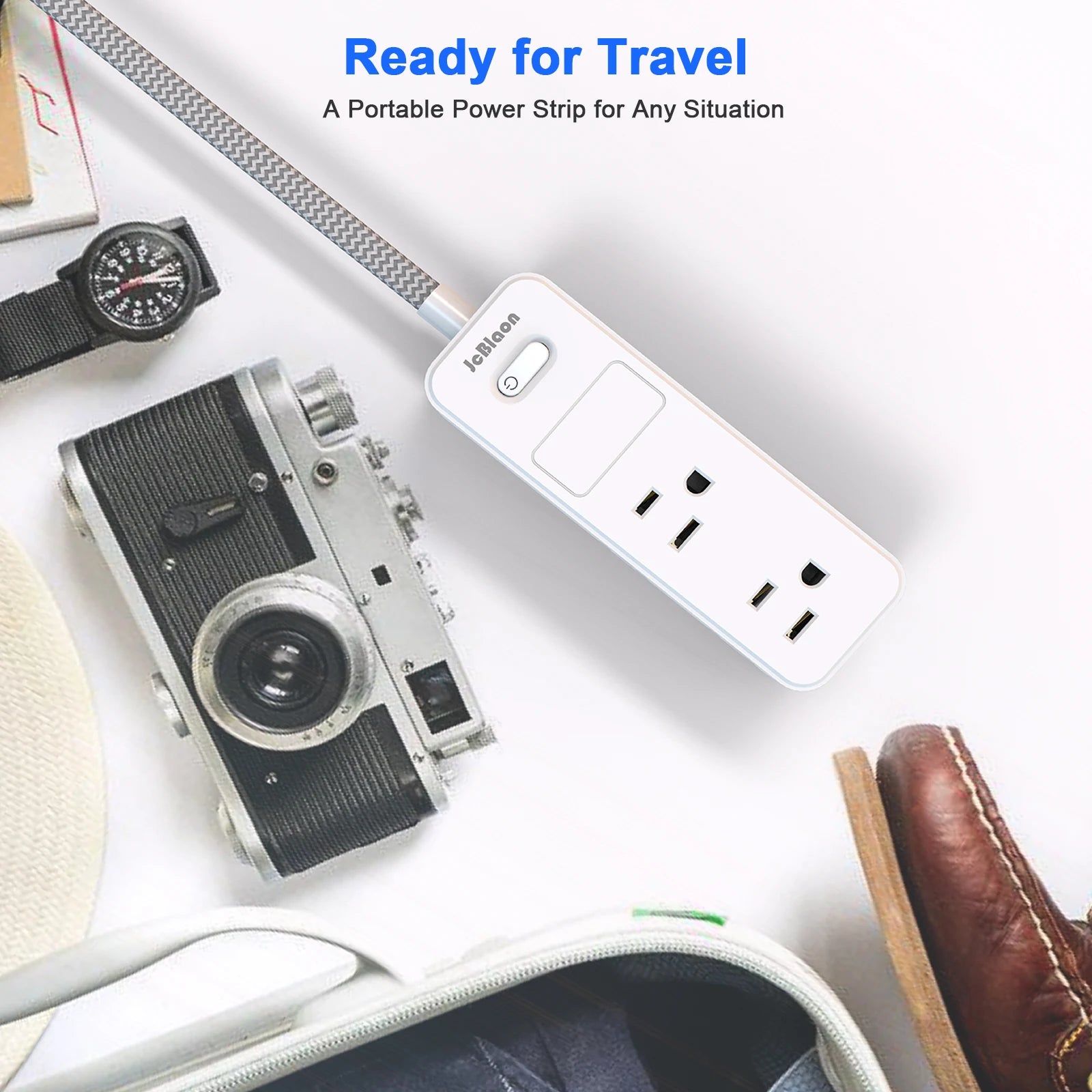 Portable power strip with camera, watch, and shoes on a white surface with 'Ready for Travel' text.