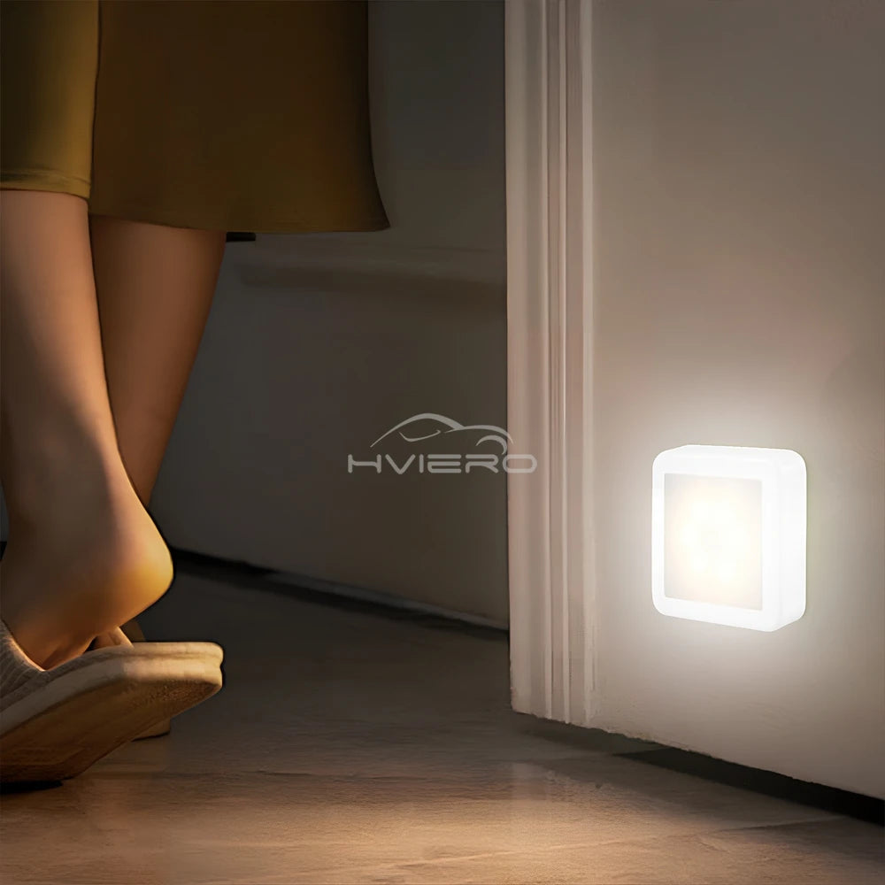 Person standing near a wall-mounted light with 'HVIERO' branding.