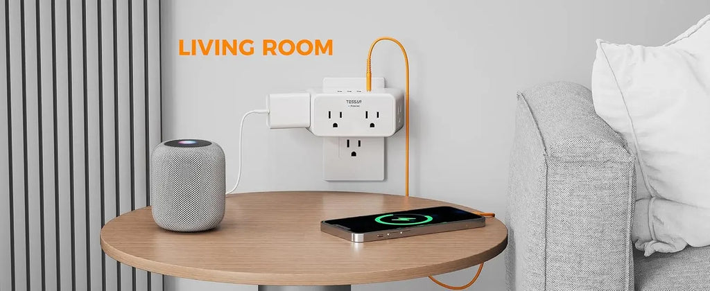 Living room setting with a round wooden table, smartphone on a wireless charger, and a speaker.