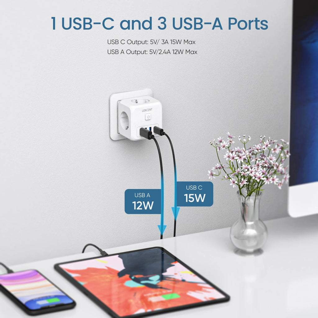Power adapter with USB-C and USB-A ports charging a tablet and smartphone on a white surface.