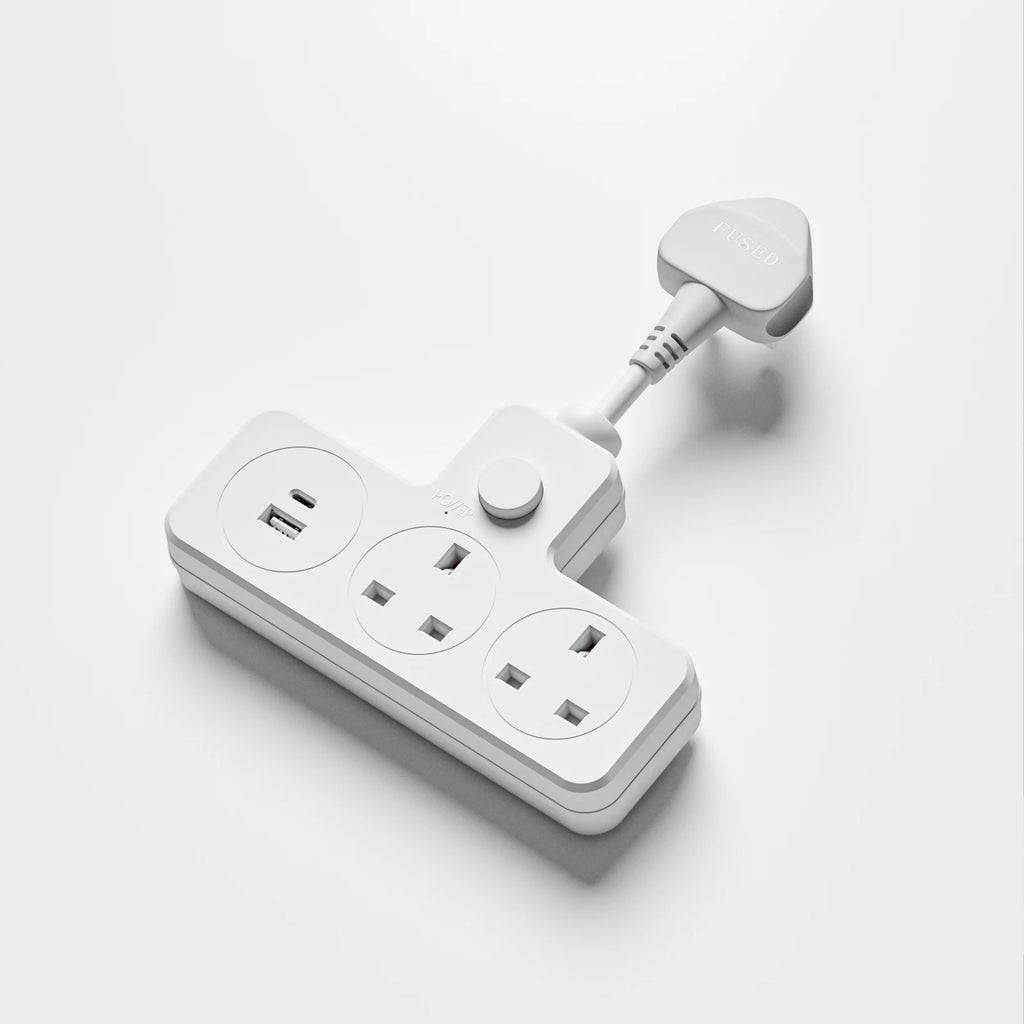 White power strip with multiple outlets on a light gray background