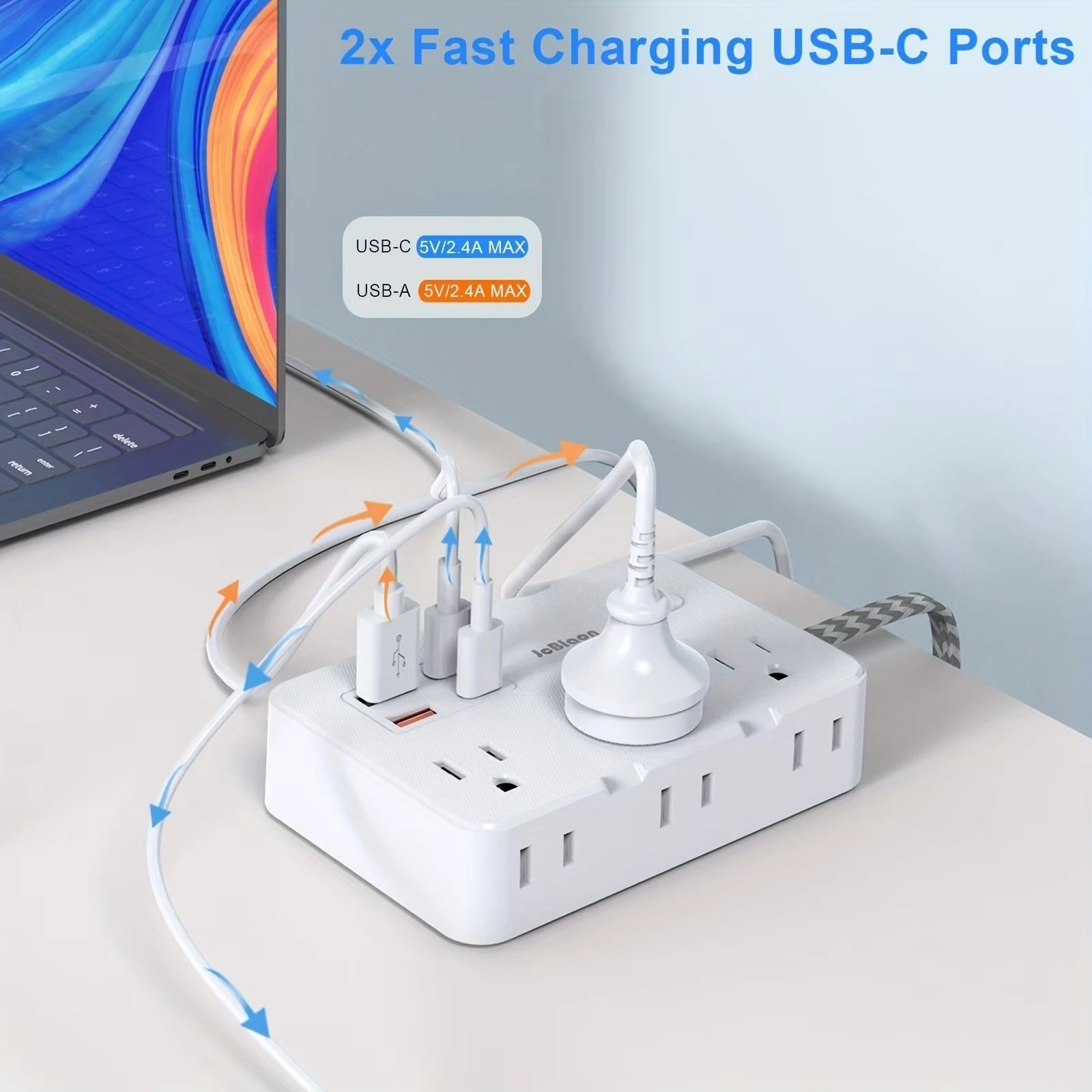 White power strip with multiple outlets and USB ports, connected to a laptop, on a light gray surface.