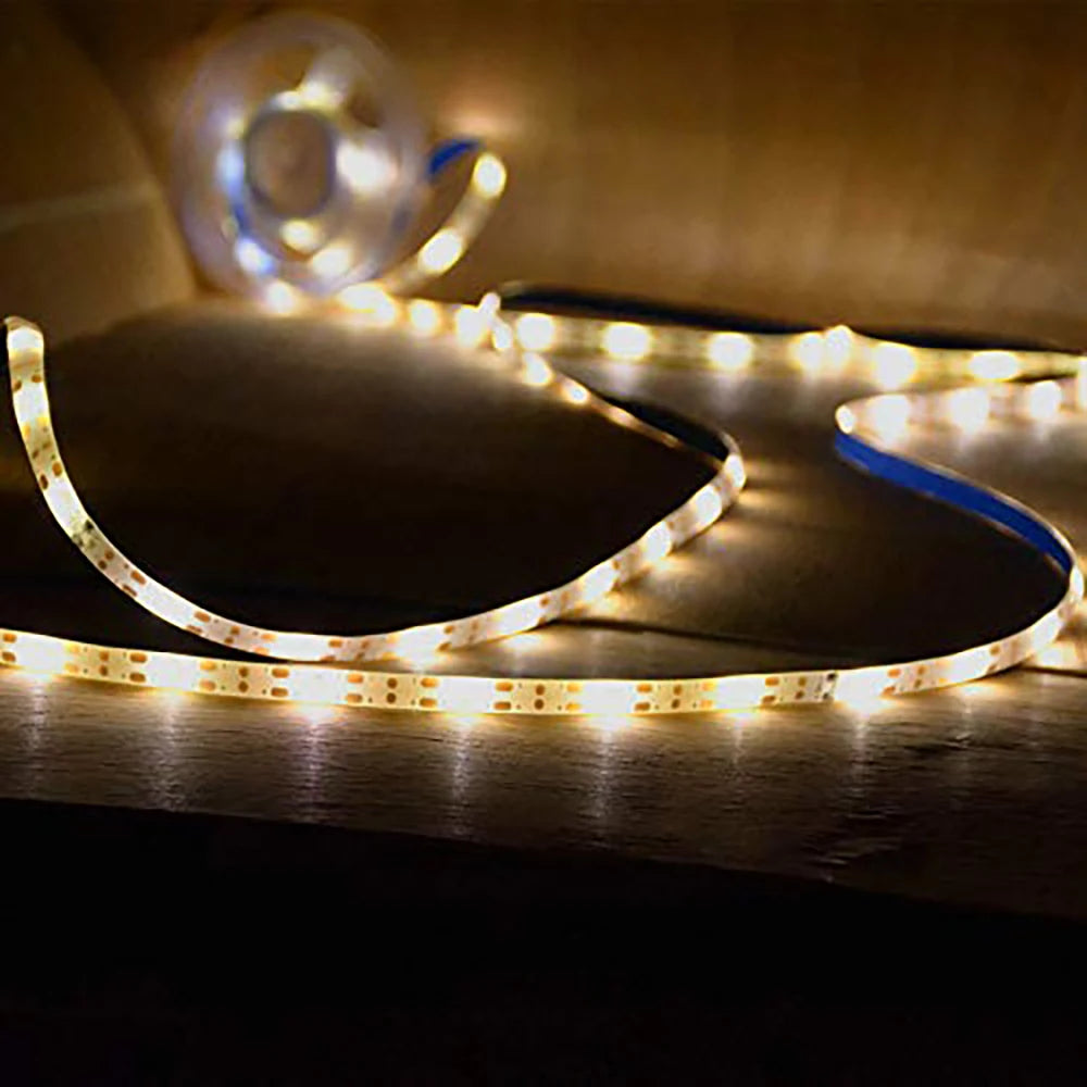Outdoor RGB solar LED strip creating colorful ambient lighting