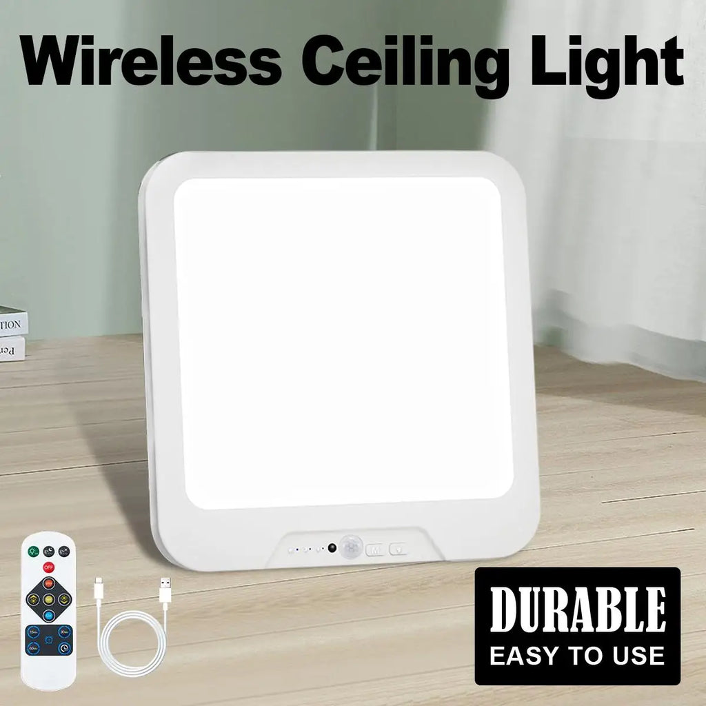 Wireless ceiling light with remote control and cable on a wooden surface
